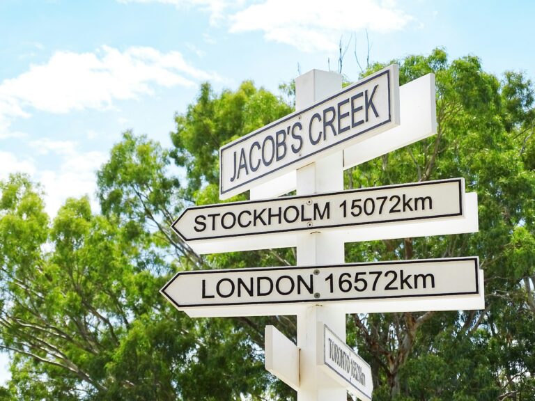 A street sign in front of some trees